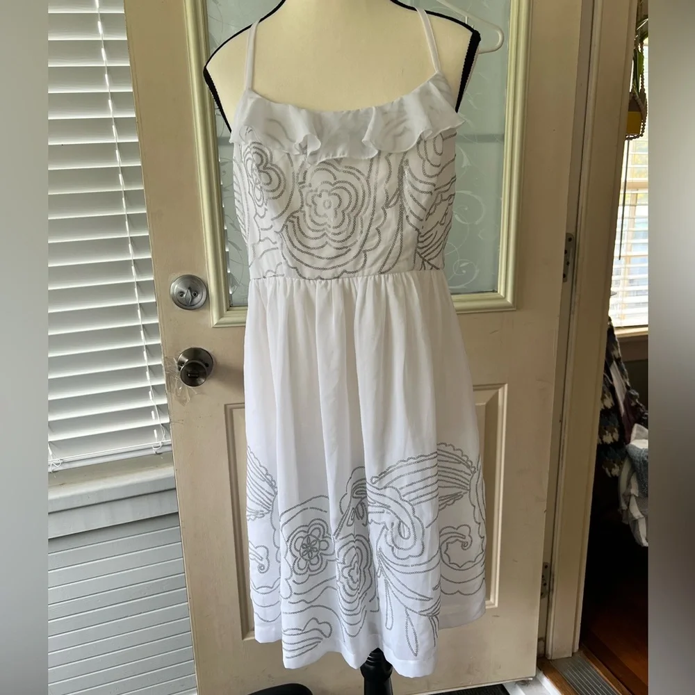 Johnny Martin size L white and silver floral Sequined dress. Racer back ruffled